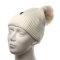 Women's beige cap with a pompom