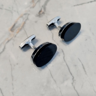 Original oval cufflinks with a black stone